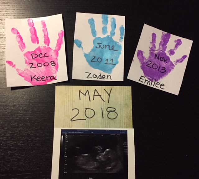 The kids hand prints, and an ultrasound picture of the baby.