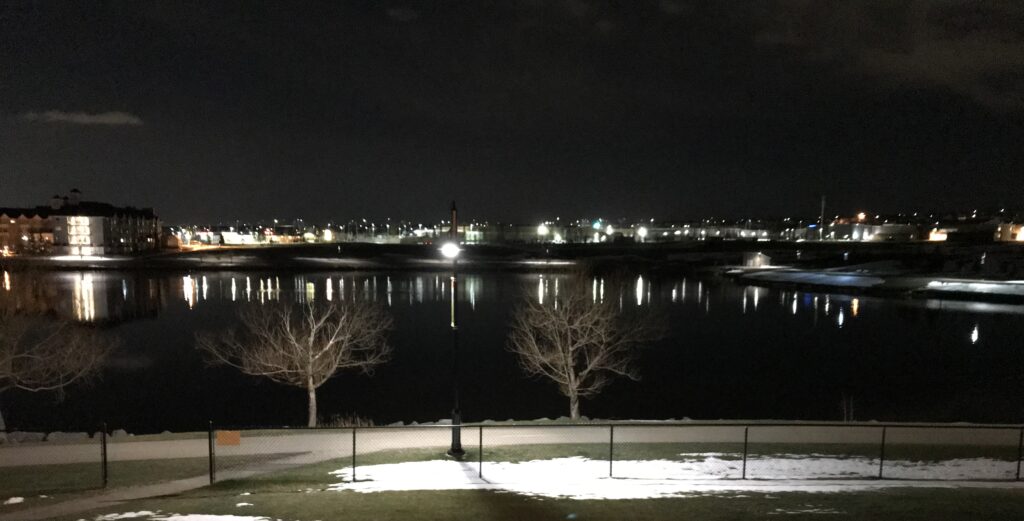 Cold night view of a pond after we got hit by a snow storm.