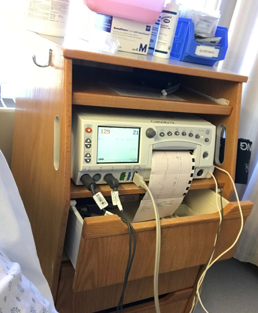 The machine in the triage room, it tracks the baby's heartbeat and my contractions. To see how intense the contractions are, and tell if I'm ready for labour or not.