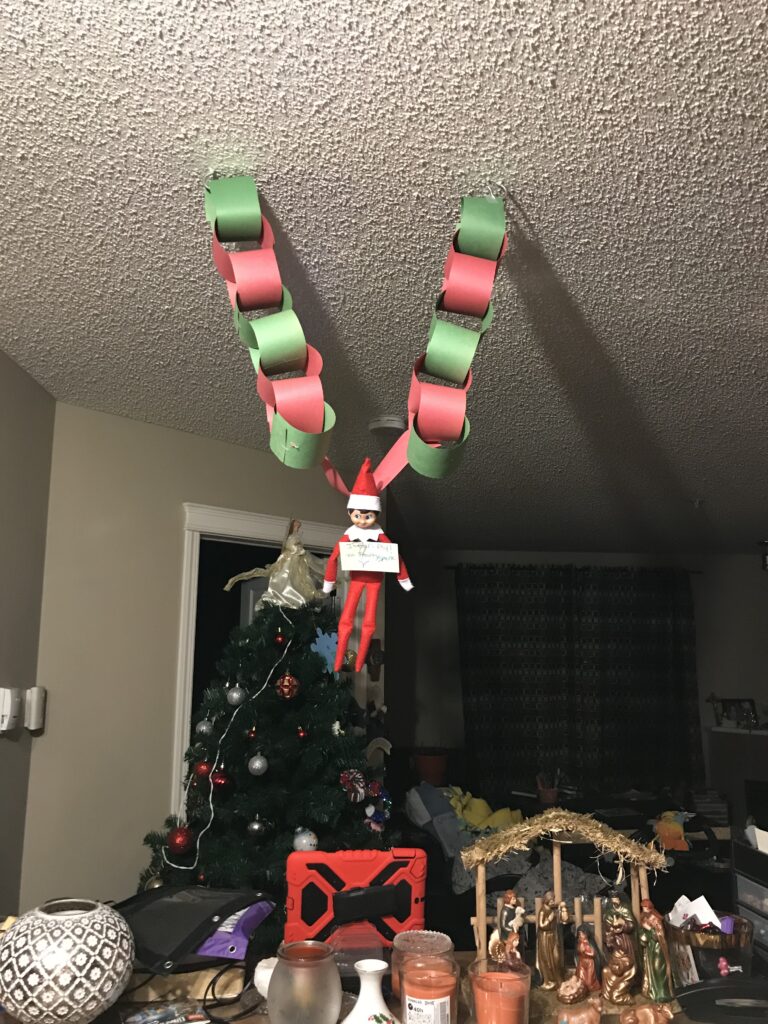 Frosty the elf flying from the ceiling.