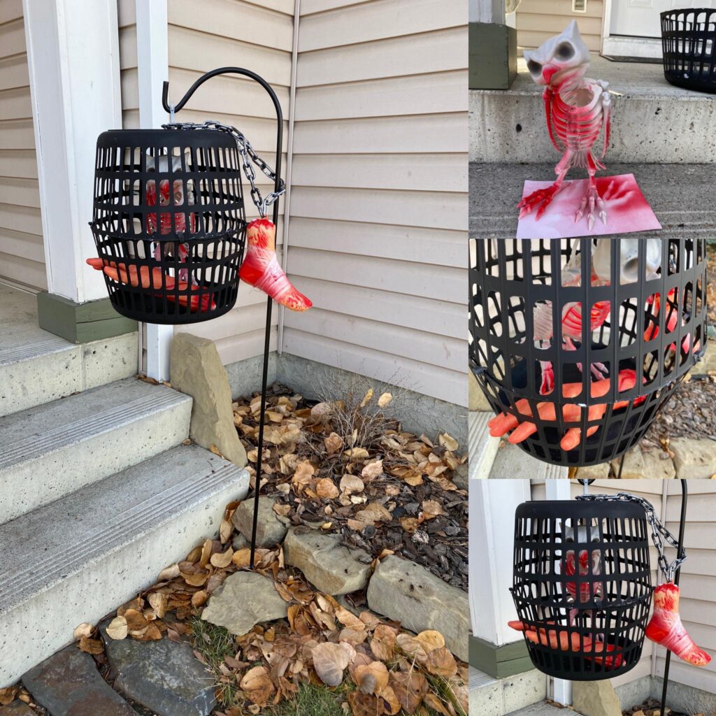 The hanging DIY halloween cage and animal skeletons painted in red paint.