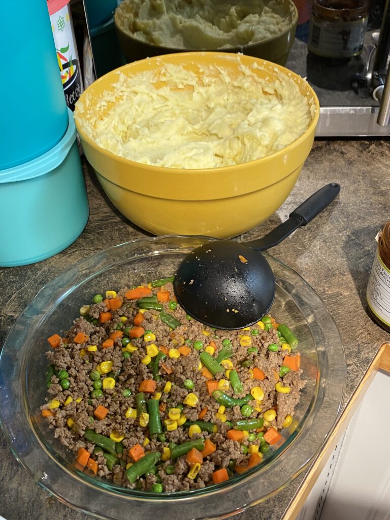 The whipped potatoes and one of the shepherds pie containers