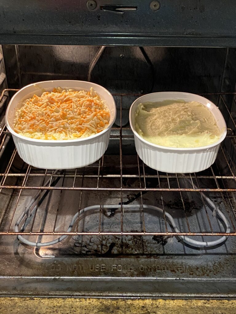 Two of the shepherds pies baking in the oven