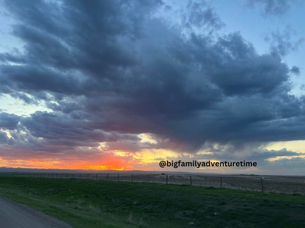 View of a field with beautiful clouds